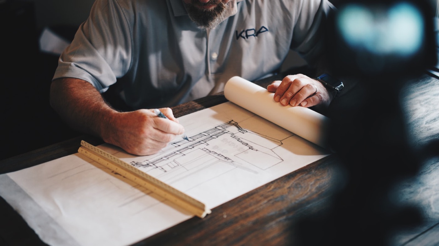 Cast Holder reviewing plans at the workbench