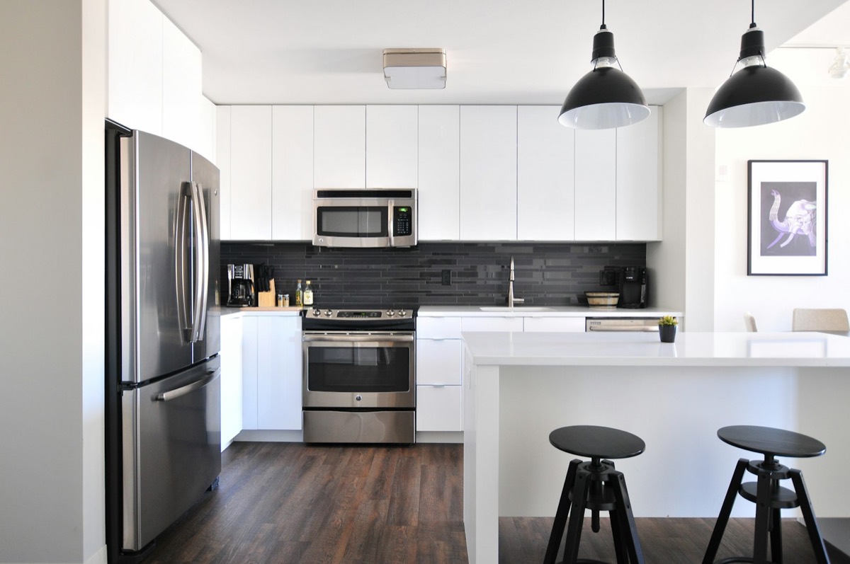 Custom remodeled kitchen with stone counters and tile